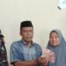 Warga Secanggang Terima BLT (foto/sofyan)