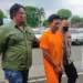 M Ridwan (39) saat digelandang ke Polresta Bandar Lampung. (Foto/Doc)