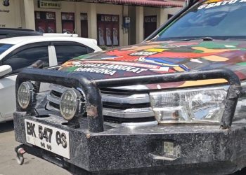 Mobil Bercat Loreng Milik Salah Satu Ormas Yang Diamankan Polres Langkat Dikabarkan  Raib. (Foto/Supriadi).